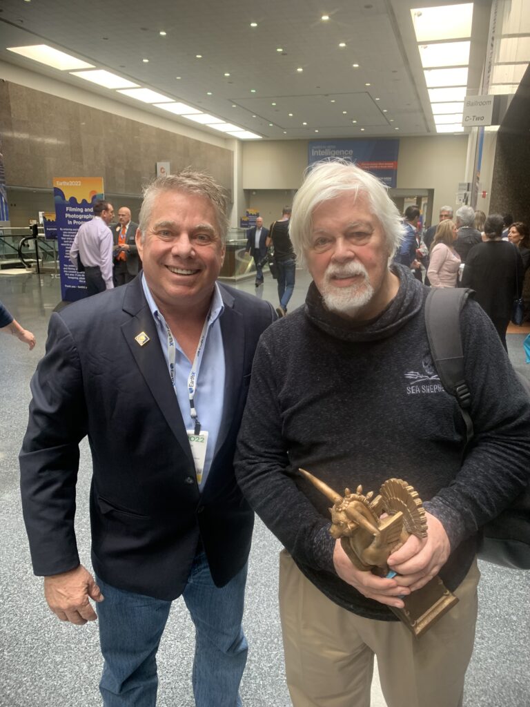 Steve Bender with Captain Paul Watson at EarthX, Dallas, holding his EarthX award.